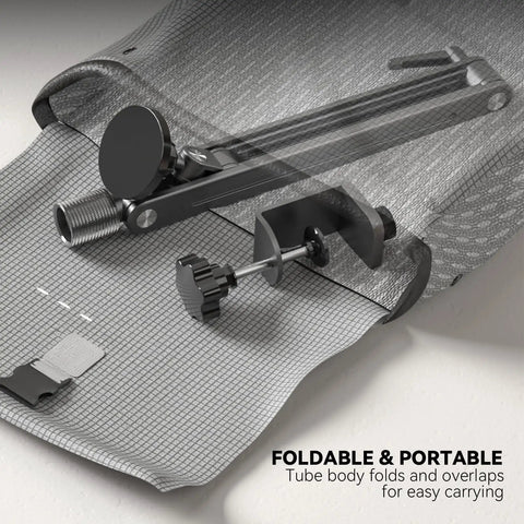 Folded Magnetic Portable Monitor Arm With 360 Degree Swivel on gray textured surface showing heavy duty aluminum clamp.