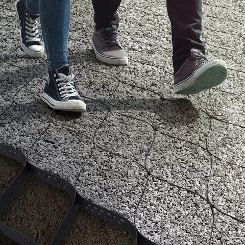 Flexible Turf Stabilizer Grid For Lawns And Walkways, 4m By 10m, Pliable And Expandable Honeycomb Drainage Grid For Beefy Lawn Stability with gravel and people walking on it