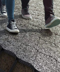 Two people walking on Tough As Nails Ground Stabilizer Grid For Lawn And Slope Erosion Control With Durable Drainage 5cm High 6m By 9m