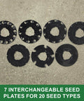 Image showing 7 interchangeable seed plates for the 3lb Garden Seeder Workhorse with 7 Seed Plates For Precise Planting In Prepared Soil.