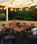 Privacy Bamboo Fence Roll For Outdoor Spaces Coffee Color 2.6x6.6ft With Cable Zip Ties shading a cozy lit patio