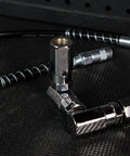 Close-up of metal fittings from Grease Gun Nozzle Kit With 10 And 18 Inch Flexible Hoses For Air Powered Grease Gun Coupler 7500 PSI
