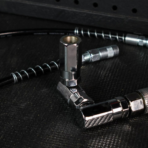 Close-up of metal fittings from Grease Gun Nozzle Kit With 10 And 18 Inch Flexible Hoses For Air Powered Grease Gun Coupler 7500 PSI