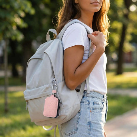 Tight Sealed Zipper Sleeve For Apple AirPods Universal Protective Cover Fits Every Gen Model with Sweet Pink Case attached to backpack.