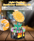 Light Chasing Sunflower Soldering Kit With RGB LED Flashing Lights showing light sensors and motor on wooden surface.