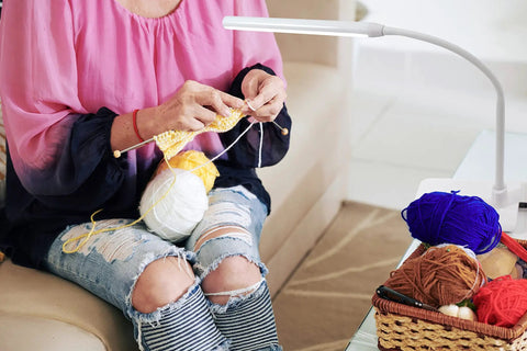 Person knitting under Uno LED Art And Craft Table Lamp With Independent Switch Flexible Arm And Single Adjustable Head in white