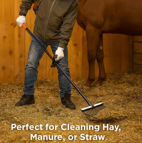 Person using Heavy Duty Metal Horse Manure Fork With Long Steel Handle Built Tough Two Pack Poop Shovel Rake on stall floor