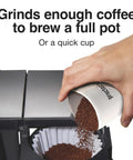 Fresh Grind Electric Coffee Grinder For Up To 12 Cups With One Touch Operation pouring ground coffee into a filter