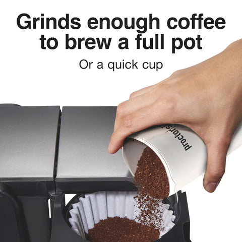 Fresh Grind Electric Coffee Grinder For Up To 12 Cups With One Touch Operation pouring ground coffee into a filter