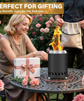 Smokeless Tabletop Fire Pit For Outdoor Use Portable Mini Stove With Carry Bag lit on a table with flowers and gift box