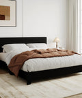 Queen Size Faux Leather Bed Frame With Adjustable Headboard In Sleek Black in modern bedroom setting with brown bedding.
