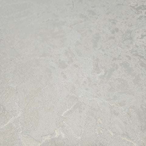 Ivory And Off White Rose Gold Cracked Faux Concrete Plaster Textured Wallpaper Rolls close-up view of matte texture.