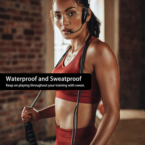 Woman wearing waterproof wireless headset microphone system for fitness instructors and online teaching, holding jump rope.