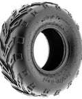 Close view of 145/70-6 tubeless ATV go-kart tire with deep treads for off-road trail, mud, sand, and rocky terrain