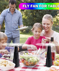 Family enjoying picnic outdoors with Four Pack Portable Fly Fans For Tables Indoors Outdoors Battery Powered Tabletop Fans
