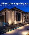 All-In-One LED Low Voltage Landscape Lighting Kit with 6 path lights and 2 spotlights illuminating house pathway at night.