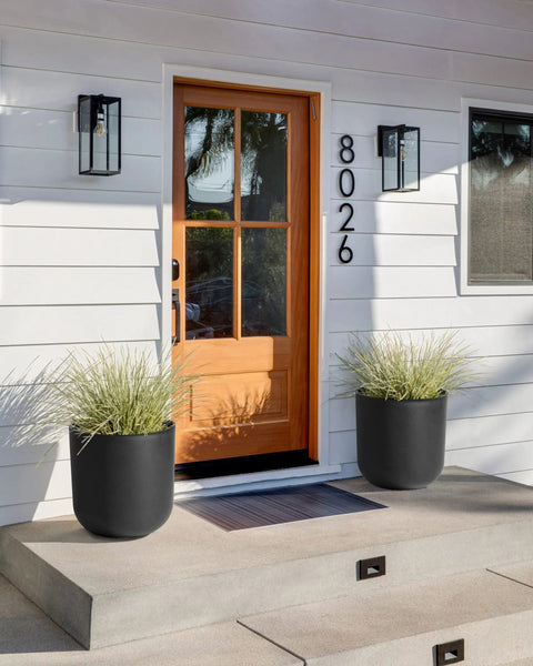 Round Black Plastic Planter Pots With Drainage Holes For Indoor Outdoor Use by a front door with plants, 20 inches