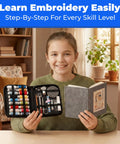 Child holding Beginner Embroidery Kit With 86-Piece Tools Set And Hoop beside a DIY cross stitch practice book