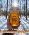 Slick Maple Syrup Tapping Kit With Ten Heavy Duty Spiles Precision Drill Bit And Three Foot Tubing Drops For Smooth Tree To Bucket Transfer And Zero Drip Nonsense Perfect For First Time Tappers Seeking Fresh Maple Gold in a snowy forest.