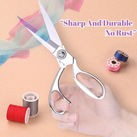 Hand holding stainless steel sewing scissors from Handheld Sewing Machine With Elegant Wooden Box And 153 Piece Kit.