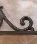 Detail view of the heavy duty Victorian corner shelf bracket solid cast iron rustic brown finish.