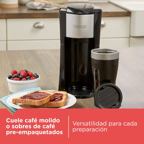 Compact Single Serve Coffeemaker That Brews Right Into The Included Travel Mug on kitchen counter with toast and berries.