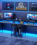 60 Inch Black Computer Desk With 4 Drawers And Printer Space, dual monitors, LED lights, and accessories in gaming setup
