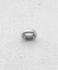 Close-up of a single Presta Valve Core Lock Ring Nut from 10 Pack Durable Metal Lock Rings for Presta Valves and Bicycle Inner Tubes.