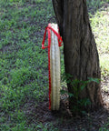 Backyard Archery Target For Adults And Youth, Easy Arrow Removal And Durable Straw Target For Outdoor Practice leaning on a tree