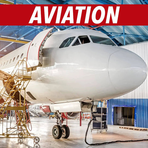 Front view of a commercial airplane in a hangar undergoing maintenance, surrounded by equipment and scaffolding.