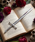 Dope Vintage Sword Letter Opener With Silver Finish And Ergonomic Grip on open book among roses and skull decor