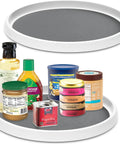 Set Of Two 12 Inch Non Skid Lazy Susan Organizer Smooth Spinning Turntable For Pantry Cabinet Kitchen Storage with various jars.