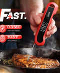 Person using a red 0.3 Second Instant Read Digital Meat Thermometer For Cooking And Grilling on steak, showing LCD display.