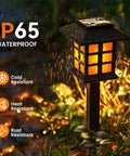 Outdoor Solar Torch Lights 10 Pack With Dope Flickering Flame lantern in garden, IP65 waterproof, glowing in rain at night