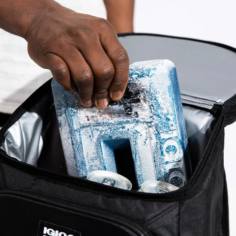Placing Long Lasting Reusable Ice Packs For Coolers Refreezable Gel Ice Blocks With Non Toxic Formula into cooler for camping.