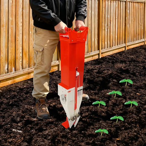 Easy To Use Manual Vegetable Seeder And Fertilizer Tool, Handheld Garden Planter used in a garden with corn seedlings