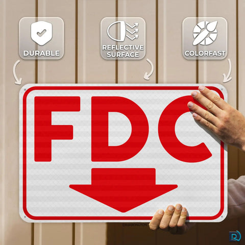 Heavy Duty FDC Sign With Down Arrow 18 X 12 Inch 0 040 Aluminum Fire Department Connection Plate held up, showing reflective surface.