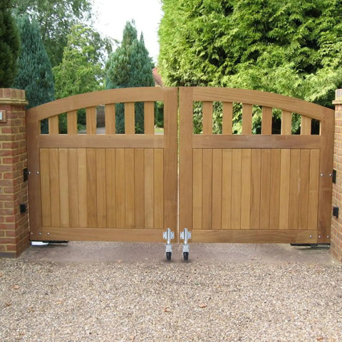 Wooden gate with Beefy Spring Loaded Gate Support Wheel For Wooden And Metal Gates, Heavy Duty Gate Roller With 200 Lbs Load Capacity installed.