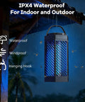 IPX4 waterproof 2 In 1 Mosquito Zapper For Indoor And Outdoor Use with hanging hook in a rainy outdoor setting