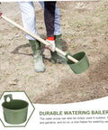 Ergonomic Garden Water Scoops Two Pack For Easy Plant Care, Multi Purpose Water Ladles For Efficient Watering And Fertilizing, Durable Plastic Tools For Home Yard Maintenance, Quick Reach For Pots, Beds, And Raised Planters. Green plastic watering scoop in use on garden soil