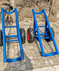 Beast Mode Heavy Duty Utility Pole Dolly With 2 Wheels For Concrete Power Poles And Site Transport Cart, Sturdy Welded Steel Frame, Thick Pneumatic Tires, Portable Hand Cart For Quick, Easy Pole Handling On The Job. blue welded steel pole dolly with two wheels on a paved site