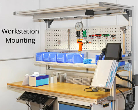 Workstation with tools and storage boxes mounted on pegboard, showcasing ergonomic setup and organized workspace.