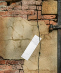 Heavy Duty Waterproof Butyl Tape 10cm By 5m Self Adhesive Aluminum Foil Sealant Tape applied on a cracked wall, weatherproof sealing for repairs