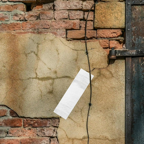 Heavy Duty Waterproof Butyl Tape 10cm By 5m Self Adhesive Aluminum Foil Sealant Tape applied on a cracked wall, weatherproof sealing for repairs