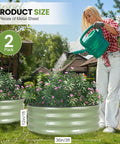 Person watering plants in Round Raised Garden Bed Set Of Two 3x3x1 Ft Heavy Duty Galvanized Steel Planter Boxes with flowers