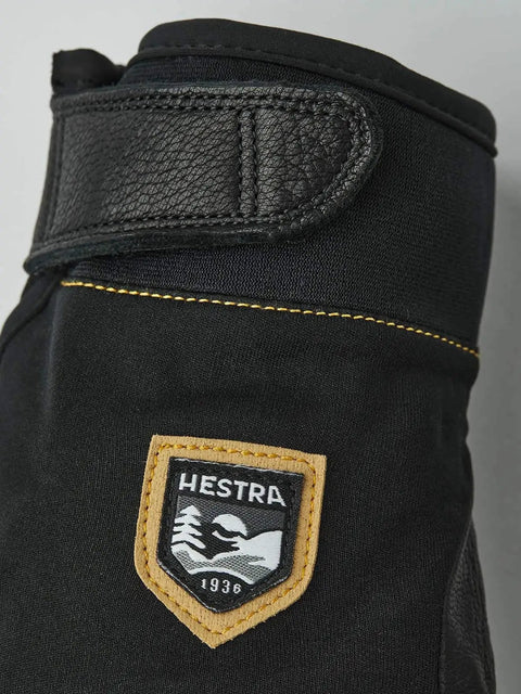 Close-up of logo and strap on Ergo Grip Czone Tactility Short Glove For Rugged Mountaineering And Ice Climbing, Black Size 11