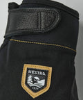 Close-up of Ergo Grip Czone Tactility Short Glove for Mountaineering and Ice Climbing, showing black wrist closure and logo, Size 10