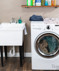 Heavy Duty Plastic Laundry Tub Featuring A Spacious 21 Gallon Basin With Sturdy Adjustable Freestanding Frame And Sleek Two Handle Faucet For Quick Household Cleanups No Sweat, adjacent to washing machine.