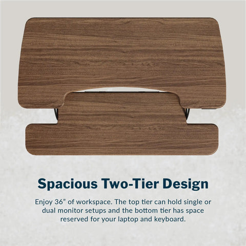Top view of Vari Pro Plus 36 Electric Standing Desk Converter In Stylish Walnut Finish showing two-tier design for dual monitors and laptop.