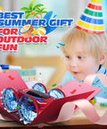 Child celebrating with gift-wrapped amphibious RC car toy; Amphibious RC Car Boat With 4WD Gesture Control And Magnetic Charging 60 Minute Playtime LED Lights Waterproof Pool Toy For Kids 6 To 12 Totally Fun Gift For Boys And Girls.